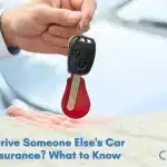 Person holding car keys next to a borrowed car