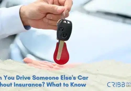 Person holding car keys next to a borrowed car