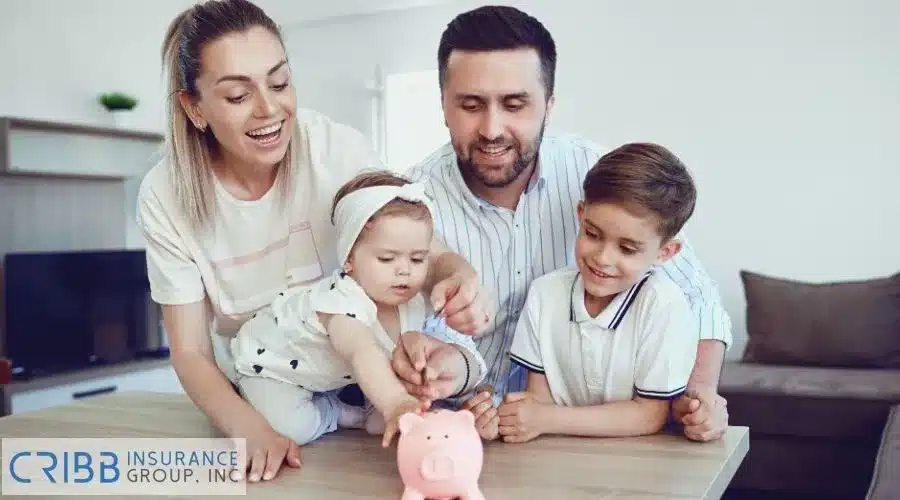 A-happy-family-saving-money-together-with-a-pink-piggy-bank