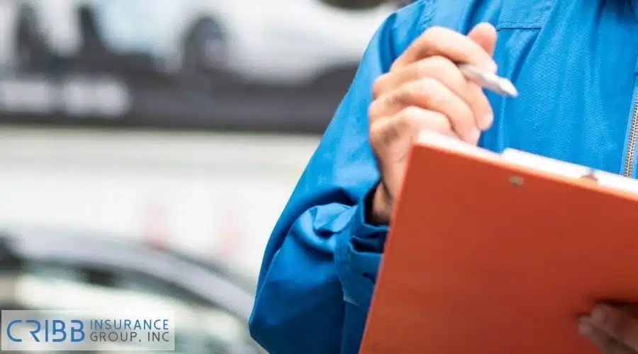 Holding a checklist of steps to take if your car is stolen.