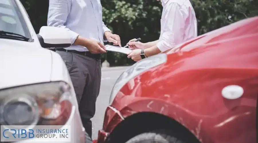 Insurance adjuster assessing a car accident for an insurance claim